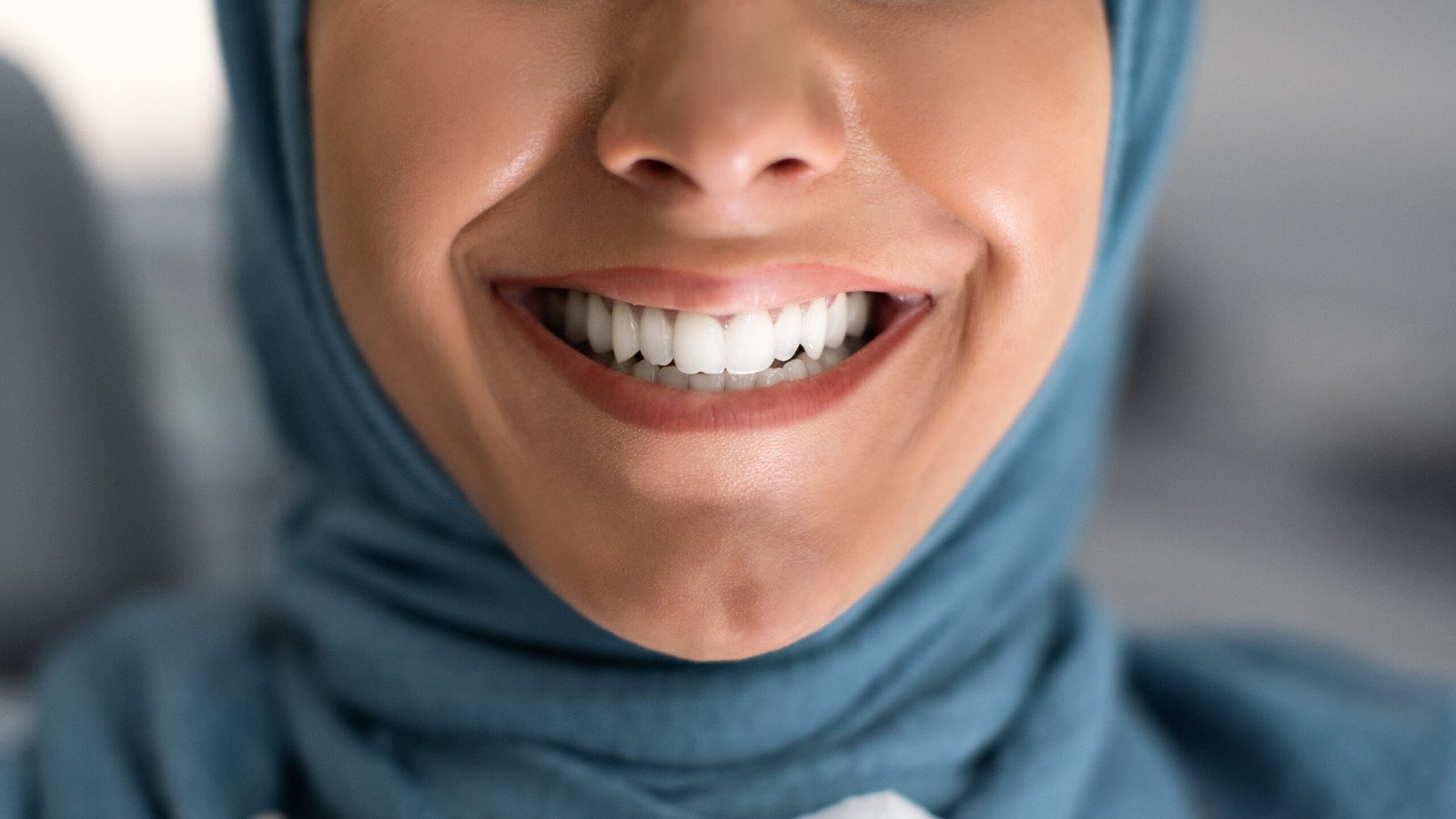 Teeth Whitening. Closeup Shot Of Young Muslim Lady Widely Smiling With Her Perfect Healthy White Teeth, Happy Islamic Lady in Hijab Enjoying Result Of Dental Treatment In Stomatologic Clinic, Cropped